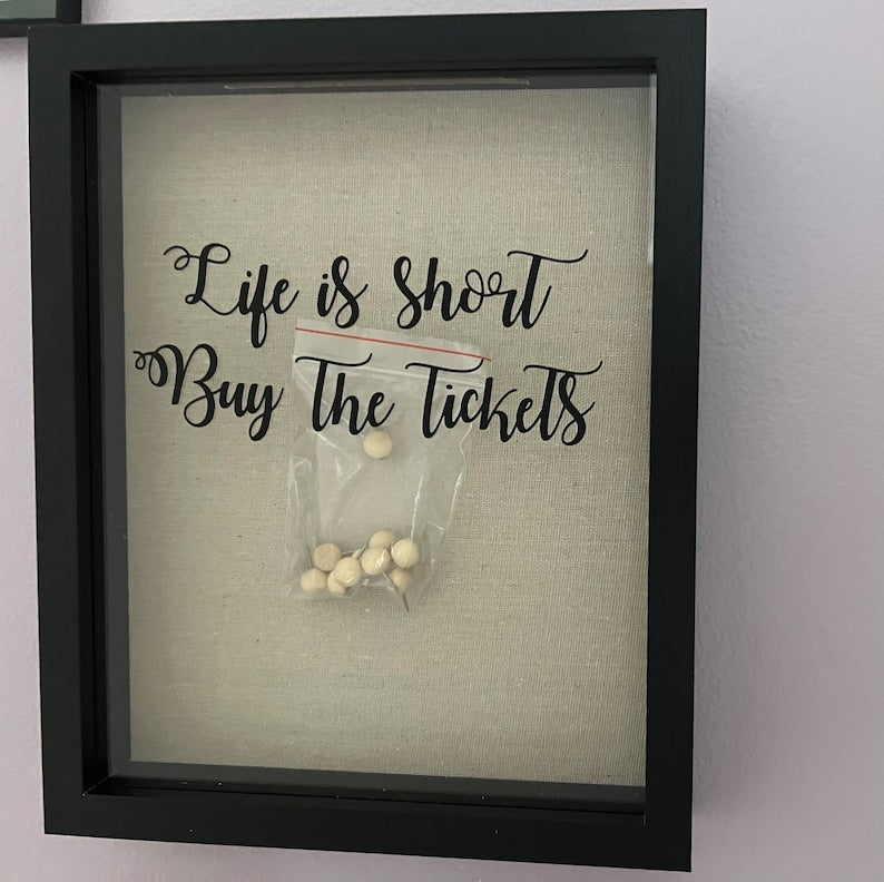 Empty black concert ticket memory box with ivory linen backing and front lettering
